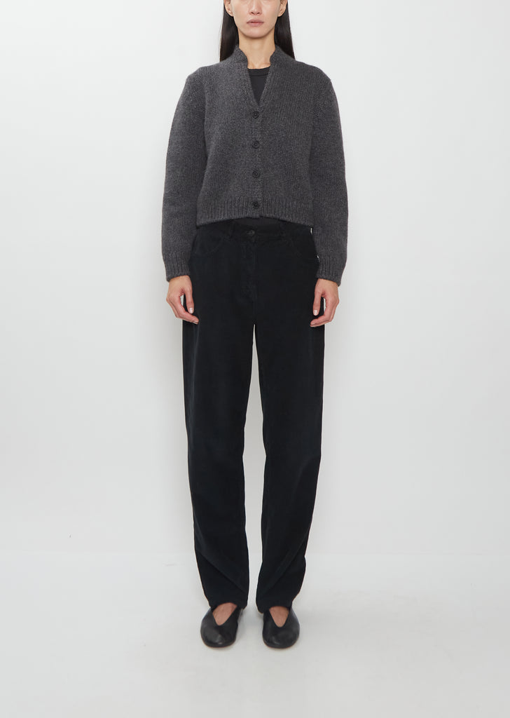 Front view of The Row Duvan Cotton Corduroy Pant in faded black on a model.