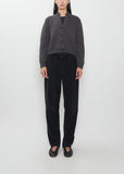 Front view of The Row Duvan Cotton Corduroy Pant in faded black on a model.