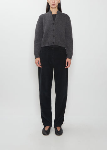 Front view of The Row Duvan Cotton Corduroy Pant in faded black on a model.