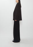 Side profile of The Row Cinna Cashmere Jacket in dark brown with matching wide-leg trousers.