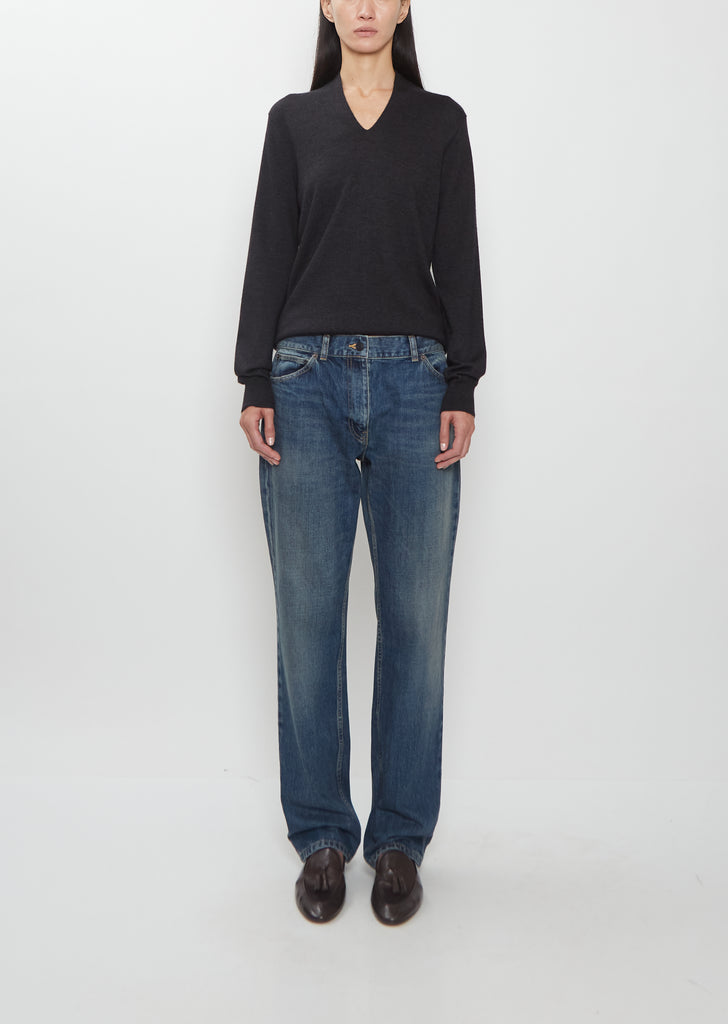 Front view of The Row Dinni Cotton Jean in medium indigo on a model.
