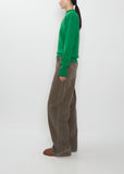 Side view of the Auralee Super Fine Wool Knit Pullover in green.