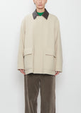 Front view of the Auralee Homespun Tweed Zip Blouson in ivory beige on a model.