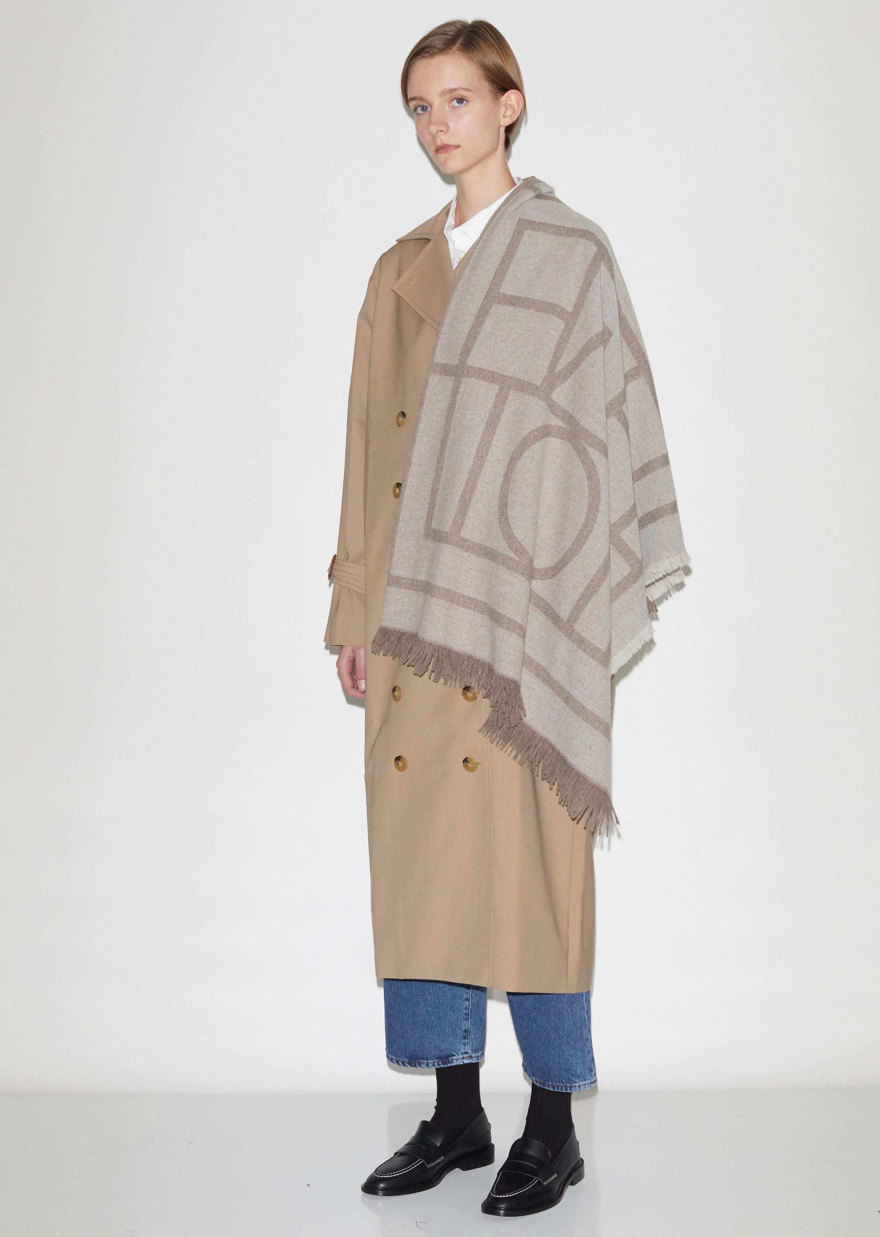 toteme como scarf tobacco - now available at toteme-studio.com Wearability is marked by the scarfs adaptability effortlessly draped over tailored outerwear for formal occasions or styled casually with knitwear in relaxed settings Rhombus Long Wool Scarf