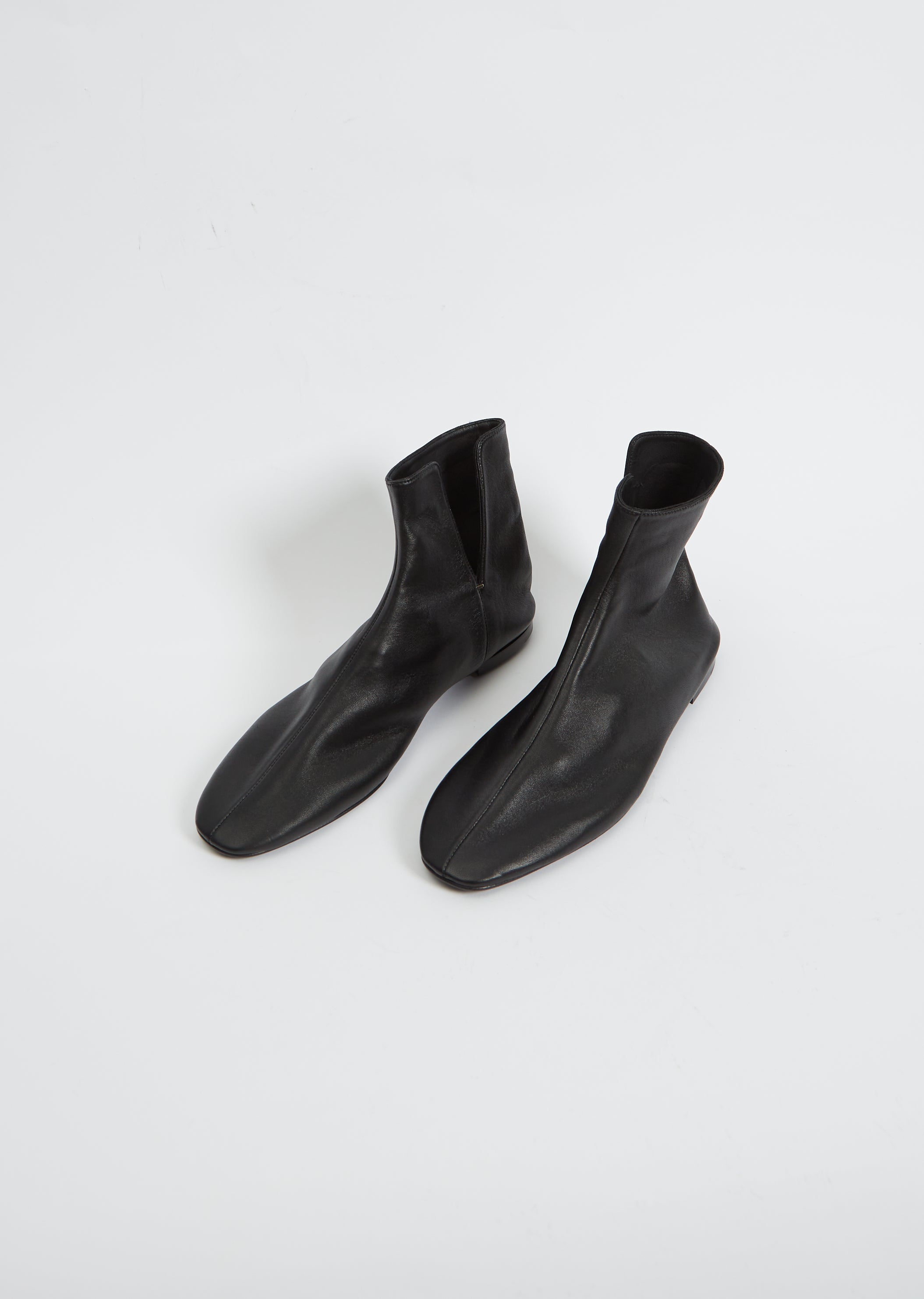 Ava Leather Ankle Boots in Black - The Row