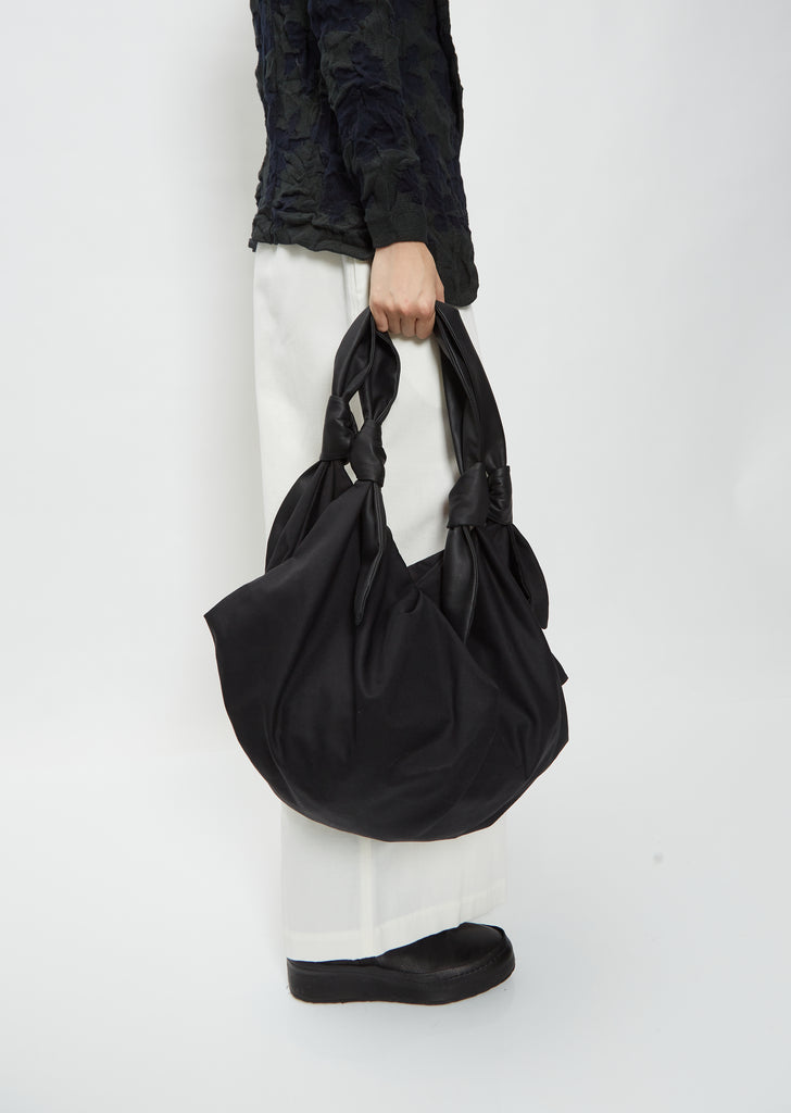 Folded Bag With Knotted Straps